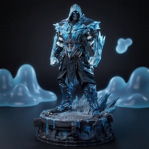 May include: A detailed figurine of a warrior clad in metallic blue and black armour with crystalline ice-like protrusions on the shoulders and arms. The figure wears a hooded mask with glowing white eyes and stands on a dark, textured circular base.