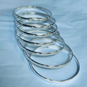Set med 7 silverarmband, handgjorda tvinnade sterling zirkonarmband. Indiska smycken
