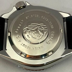 May include: Close-up of the back of a silver-toned Seiko watch. The watch has a black band and a stainless steel back with the text "ST. STEEL 6309-7290" and "WATER RESIST A". The watch also has the number "470940".