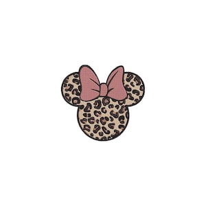 May include: A Minnie Mouse-inspired design featuring a leopard print pattern on the ears and head, with a pink bow. The design is set against a white background, creating a playful and stylish aesthetic.