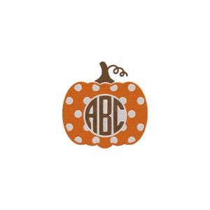 May include: An orange pumpkin embroidery design featuring a white polka dot pattern and a brown stem. In the center of the pumpkin is a circular white patch containing the brown embroidered letters ABC in a classic serif monogram font style.