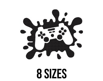 Peut inclure: Un contrôleur de jeu vidéo blanc sur un motif d'éclaboussure d'encre noire. Le texte "8 SIZES" est affiché en gras, en noir, sous le graphique. L'image est sur fond blanc.
