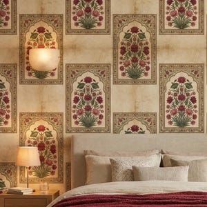 May include: A bedroom scene with a bed featuring a beige headboard and bedding, a burgundy throw, and two wooden bedside tables. The wallpaper displays a repeating floral pattern in red, green, and beige. Two wall sconces and two lamps provide soft lighting.