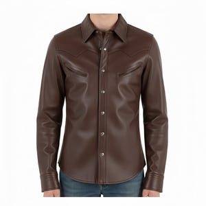 May include: A brown leather shirt with a classic collar, snap closures, and two chest pockets. The long-sleeved shirt has a Western-style yoke design and is made of a smooth, supple leather material. The shirt is worn with blue jeans.