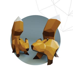 May include: Two brown papercraft squirrels with white-tipped tails are featured against a light blue background. The text "squirrel pack" is below the squirrels. The image is a promotional graphic for a papercraft product.