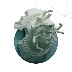 May include: A white, geometric papercraft sculpture of Medusa Gorgon, set against a teal circle. The artwork features sharp angles and a detailed design. Text at the bottom reads "MEDUSA GORGON". Copyright 2017 Paperfreak.