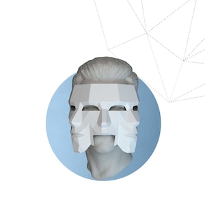 May include: A white three-face mask design, set against a light blue circle, atop a statue bust. The words "THREE-FACE MASK" are below the image. The Instagram handle and copyright information are at the bottom.