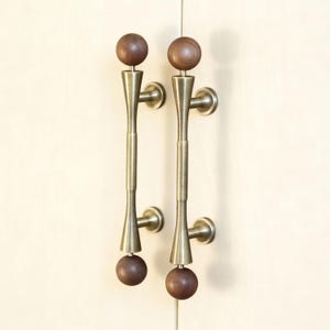 May include: A rustic wooden sign with the text "Welcome to our porch" in white lettering. The sign features a distressed finish and a simple, inviting design, perfect for outdoor decor.