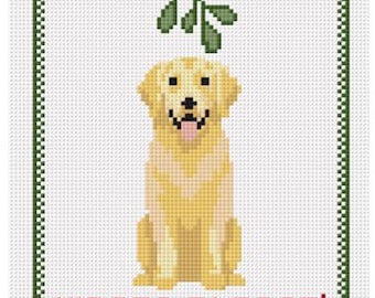 May include: A cross-stitch design featuring a golden retriever dog sitting under a sprig of mistletoe. The dog has a pink tongue sticking out. The text "KISSES PLEASE!" is in red letters at the bottom, within a green and white border.