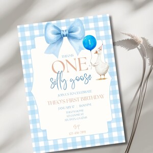 May include: A light blue and white gingham patterned invitation for a first birthday. The invitation features a blue bow, a blue balloon with the number one, and a watercolor illustration of a goose. Text includes "THEO IS ONE silly goose".