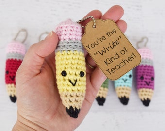 May include: A crocheted pencil keychain with a smiling face and a tag that reads "You're the "Write" Kind of Teacher!"
