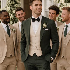 May include: A group of men in formal attire. One man wears a dark green suit with a cream-colored vest and black bow tie. Other men wear tan suits with green ties. The setting appears to be outdoors.