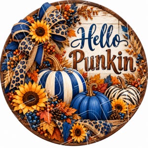 May include: A round decorative sign featuring the text Hello Punkin in dark blue and brown script. The design includes three pumpkins in blue and white stripes, solid blue, and black and white stripes, accented with sunflowers, autumn leaves, berries, pinecones, and a blue leopard print bow.