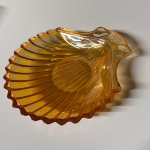 May include: A rustic wooden sign with the text "Welcome to our home" in white lettering. The sign features a distressed finish and a simple, inviting design, perfect for a front porch or entryway.