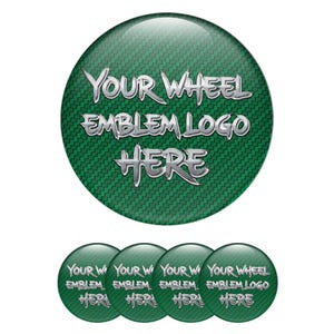 May include: Green wheel emblems with silver text reading "YOUR WHEEL EMBLEM LOGO HERE". The emblems have a carbon fibre texture. Several smaller versions of the emblem are also shown.