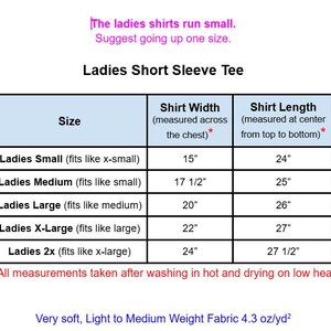 May include: A size chart for a short sleeve tee with text stating: The ladies shirts run small. Suggest going up one size. The table lists sizes from small to 2x with corresponding width and length measurements in inches from 15 to 27.5 inches.