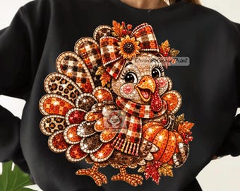 May include: A black long-sleeve sweatshirt featuring a graphic print of a turkey decorated with orange, brown, and red patterns, including plaid and leopard print. The turkey wears a plaid scarf and bow, and stands next to a pumpkin and autumn leaves.