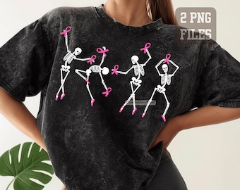 May include: A black acid-wash t-shirt featuring a graphic of four white skeletons in ballet poses. Each skeleton wears pink ballet slippers and holds a pink breast cancer awareness ribbon. The text 2 PNG FILES is visible in the top right corner.