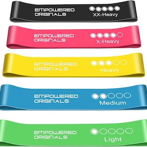 May include: Five resistance bands in a range of colours: black, pink, yellow, blue, and green. Each band is labelled with "EMPOWERED ORIGINALS" and a resistance level: XX-Heavy, X-Heavy, Heavy, Medium, and Light. Suitable for various fitness routines.