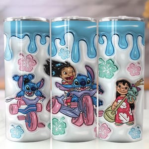 May include: Three stainless steel tumblers with a design featuring Stitch and Lilo from the animated movie. The tumblers have a white base with blue dripping accents, pink and green floral accents, and images of Stitch and Lilo.