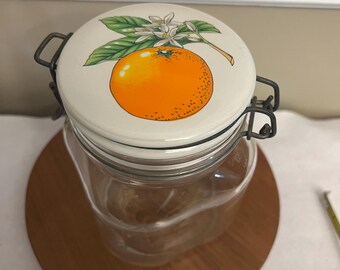 Vintage Italian Glass Storage or Canning Jar with Ceramic Lid Featuring an Orange and Blossom Motif