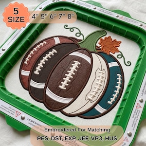 May include: An embroidery design of a pumpkin shaped like a football, featuring segments in brown, cream, and teal, with a green stem and an orange maple leaf. The design is framed in a green plastic hoop with text indicating 5 sizes: 4", 5", 6", 7", 8".