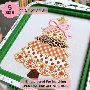 May include: An embroidery design of a Christmas tree in a green hoop, featuring five tiered layers with floral, leopard print, orange gingham, and brown polka dot patterns. A pink bow and gold star top the tree. Text includes 5 SIZE 4" 5" 6" 7" 8" and Embroidered For Matching PES, DST, EXP, JEF, VP3, HUS.
