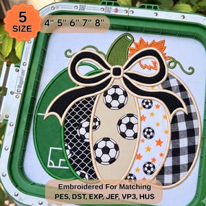 May include: An embroidery design of a pumpkin in a green hoop, featuring soccer ball patterns, black and white buffalo check, and orange stars. The design includes a black bow and text stating 5 SIZE, 4" 5" 6" 7" 8", and Embroidered For Matching PES, DST, EXP, JEF, VP3, HUS.