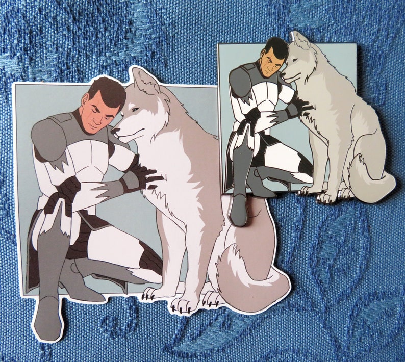 May include: A white wolf with a gray muzzle and a gray tail is sitting next to a man in a white and gray uniform. The man is holding the wolf's neck with his left hand and his right hand is on the wolf's back. The man has short brown hair and a serious expression on his face.