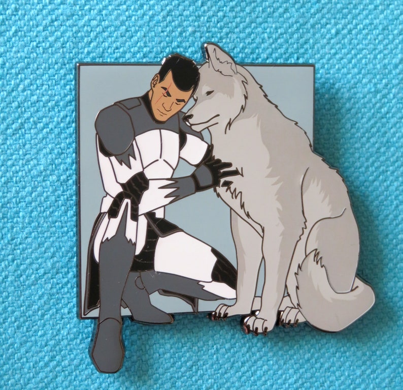 May include: A white and gray enamel pin featuring a cartoon soldier in a white and gray uniform hugging a gray wolf.
