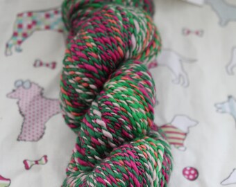 Hand spun, 100% wool, DK, pinks and greens