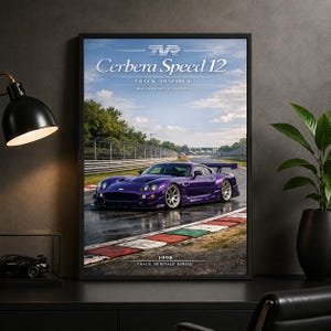 May include: A framed poster featuring a purple TVR Cerbera Speed 12 sports car on a wet racetrack. The text reads TVR Cerbera Speed 12, Track Inspired, Track Heritage Collection, and 1998 Track Heritage Series. The car has a rear wing and silver wheels.