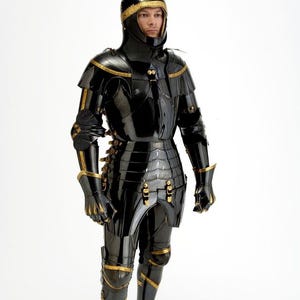 May include: A full suit of black armor with gold accents. The armor includes a helmet, chest plate, arm and leg protection, and gloves. The armor is highly polished, reflecting the light. The gold trim adds a decorative element to the medieval-style armor.