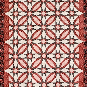 May include: A handmade quilt with a repeating pattern of red, black, and white geometric shapes. The design features star-like elements and oval shapes, framed by a floral border. The quilt is a traditional style.
