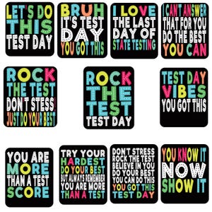 May include: A collection of nine black square stickers with colorful text. The stickers feature motivational phrases like "Let's do this test day" and "Rock the test." The text is in various colors, including green, blue, pink, and yellow.