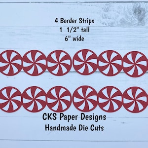 May include: Four red and white peppermint candy cane border strips, each 1 1/2 inches tall and 6 inches wide. The strips are made of paper and are handmade die cuts. The text "CKS Paper Designs Handmade Die Cuts" is printed below the strips.