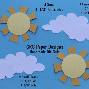 May include: Two yellow suns with brown rays and two white clouds. The suns are 3 1/2 inches tall and wide. The large clouds are 2 inches tall and 4 3/4 inches wide. The small clouds are 1 1/2 inches tall and 2 5/8 inches wide. The text "CKS Paper Designs Handmade Die Cuts" is in the center of the image.