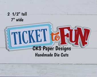 May include: A blue and white ticket with the text "TICKET to FUN!" in red and orange letters. The text "CKS Paper Designs Handmade Die Cuts" is below the ticket. The ticket is 2 1/2 inches tall and 7 inches wide.