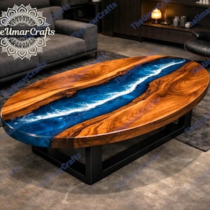 Op de afbeelding: Ovale houten salontafel met een blauw hars rivierontwerp. De tafel heeft een donkere houtnerf afwerking met een centraal blauw harsgedeelte en staat op een zwart metalen onderstel. Het Umar Crafts-logo is zichtbaar.