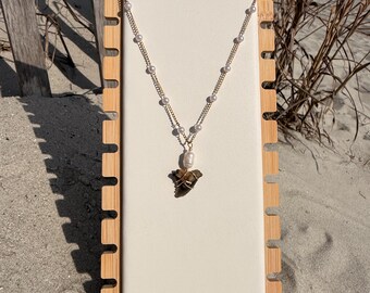 gold shark tooth necklace with pearl chain made by me :) tooth from charleston sc!!