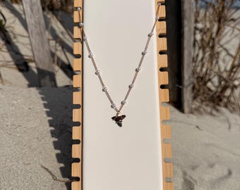 gold shark tooth necklace with a pearl chain! tooth found be me in charelston sc!