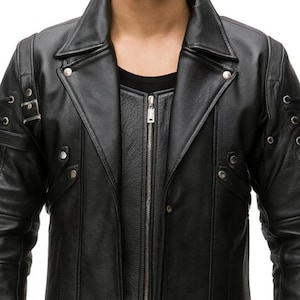 May include: Black leather jacket with a notched collar, a zip-up front, and decorative metal accents. The jacket features a layered design with a second layer visible beneath the main jacket. The sleeves have decorative details.
