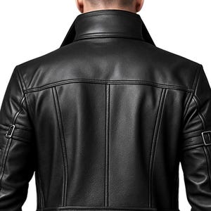May include: A black leather jacket featuring a high collar, vertical seam detailing on the back, and a horizontal waist strap with two silver-toned metal snaps. The sleeves include adjustable straps with silver-toned metal buckles on each arm.