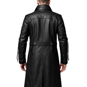 May include: A black long coat featuring a high collar, vertical seam detailing, and a horizontal waist belt with metallic buttons. The sleeves include adjustable buckle straps and decorative metal studs, with a central back vent at the hem.