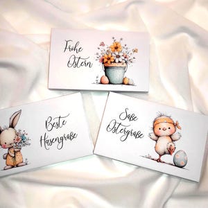 May include: Three white greeting cards with Easter-themed illustrations. One card features a bucket of flowers, another a bunny holding flowers, and the last a chick with an Easter egg. Each card has German text.