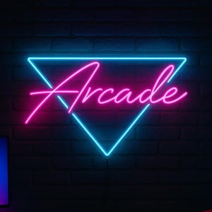 May include: A neon sign reading "Arcade" in pink script, within a blue triangle, is mounted on a dark brick wall. A computer setup and a red beanbag chair are in the room, creating a gaming atmosphere.