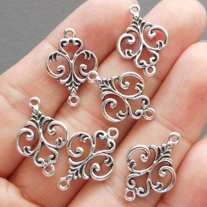 10 szt. - 2 pętle srebrnego koloru modelującego łącznik, srebrny łącznik do kolczyków, zapięcia do kolczyków - więcej kolorów