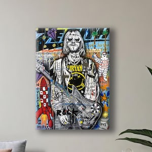 May include: A vibrant pop art style painting of a musician with sunglasses holding a guitar. The artwork features graffiti-style elements, including text and a rocket ship. The musician is wearing a shirt with the word "Nirvana".