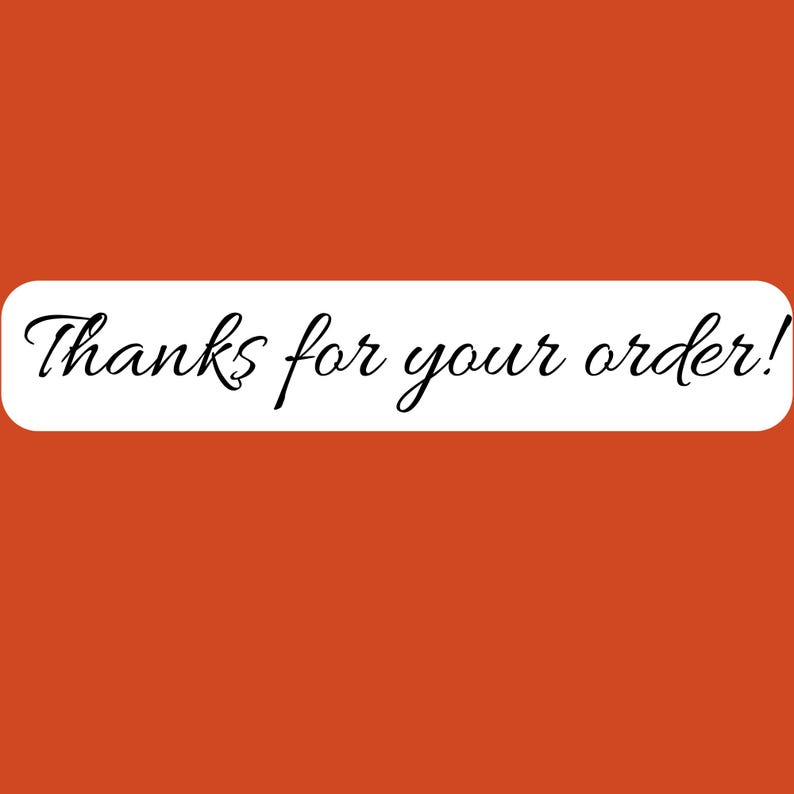 May include: A rectangular white sticker with rounded corners set against a solid burnt orange background. The text Thanks for your order! is printed in the center in a black, elegant, cursive script font, clearly legible across the white surface.