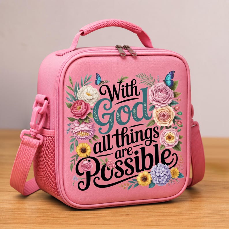May include: A pink lunch bag with a top handle and shoulder strap, featuring a floral design and the text "With God all things are Possible" in black script. The bag has a mesh side pocket and a dual zipper closure on the front panel.